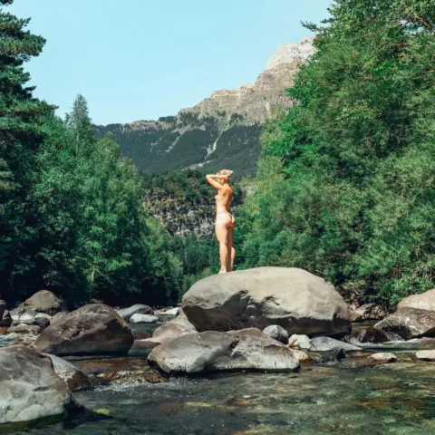 Clara Galle hot minimalist swimwear style and sun-kissed golden skin look | VaultVenus visual archive